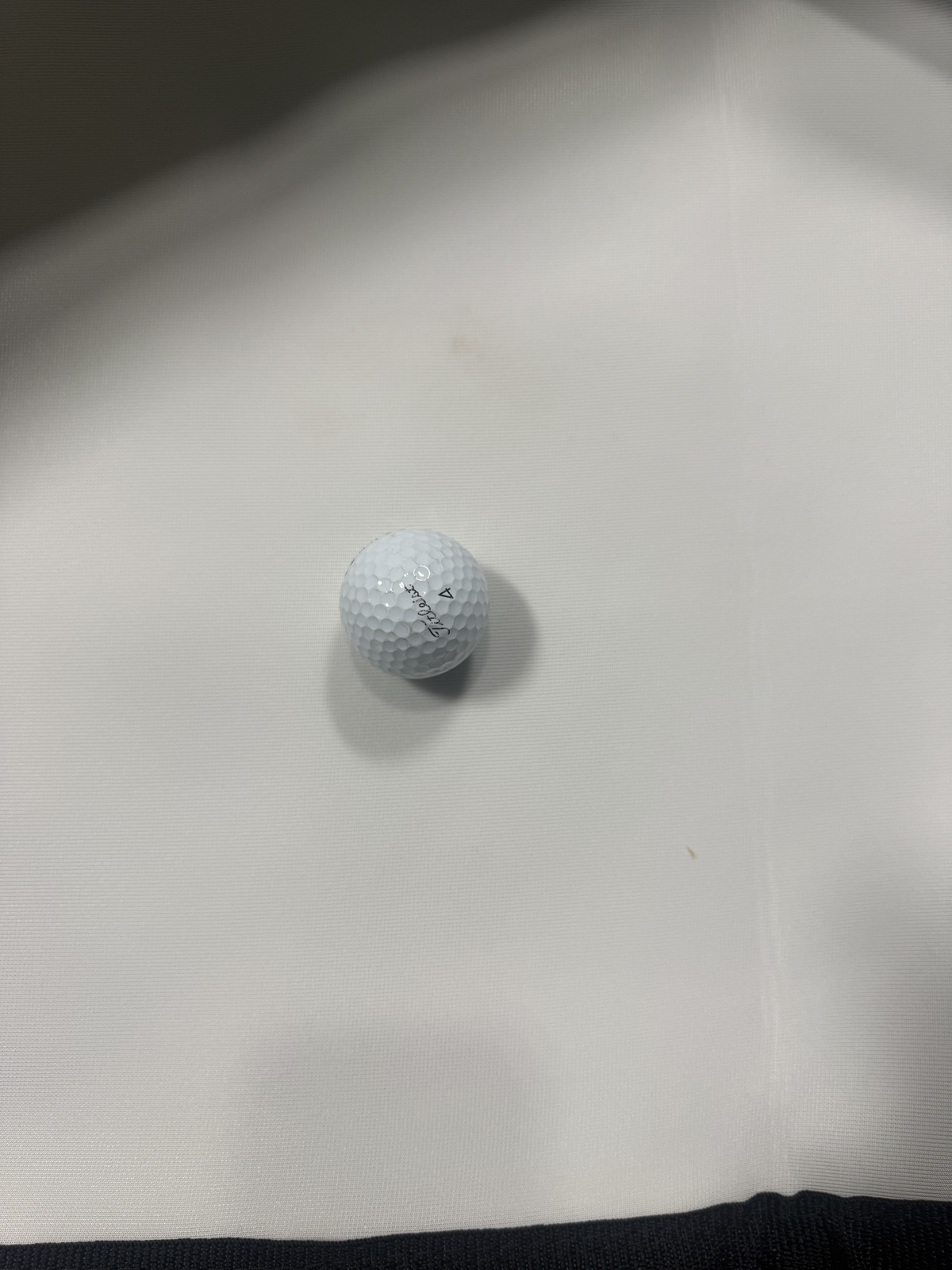 Golf ball on a white surface