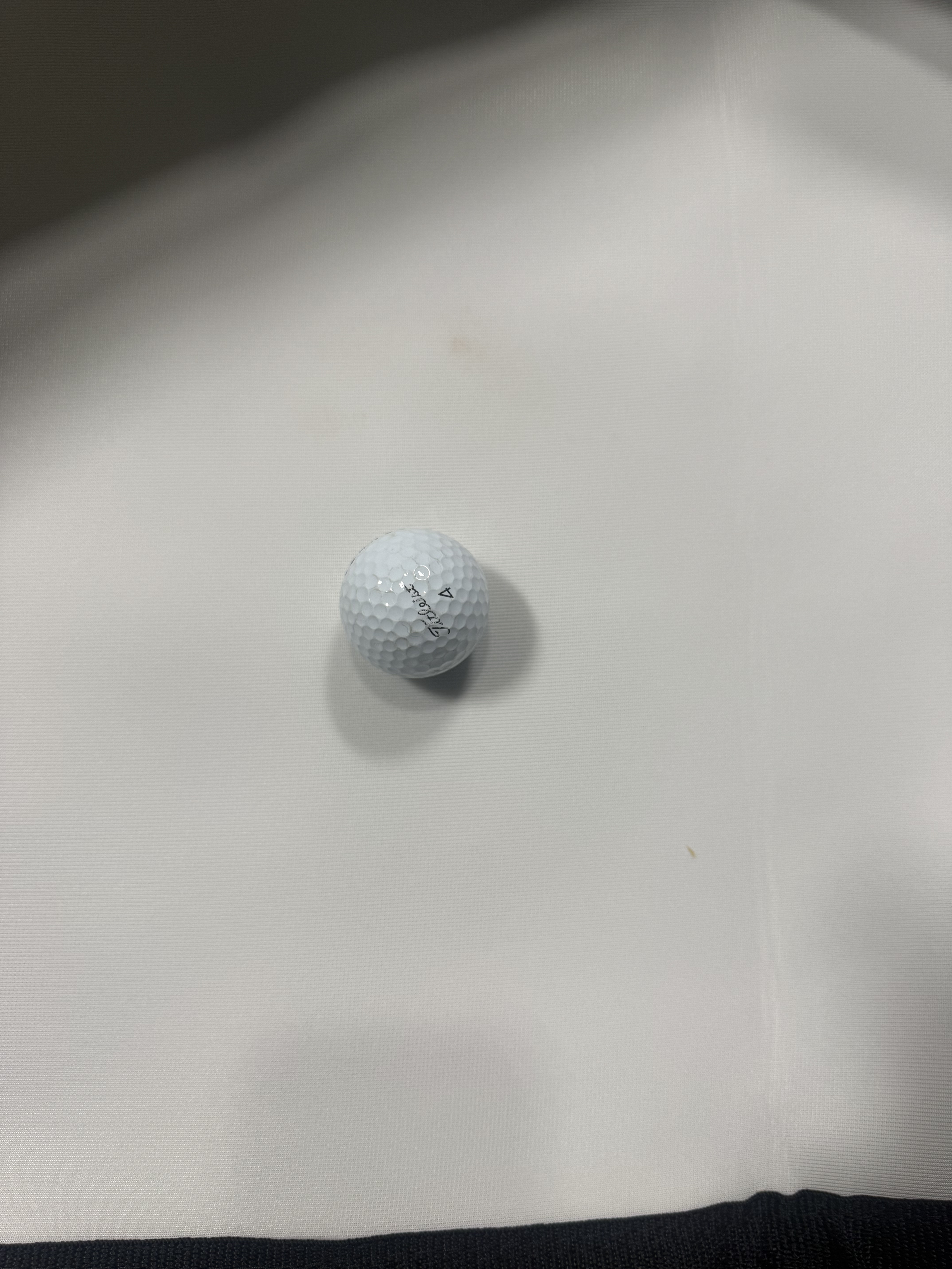 Golf ball on a white surface