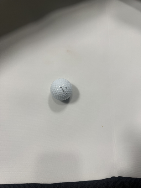 Golf ball on a white surface